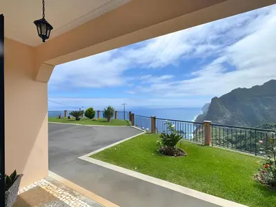 a view of the ocean from a house balcony at Vista Ventura in Ponta Delgada