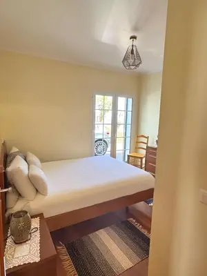 a bedroom with a bed in a room at Vista Ventura in Ponta Delgada