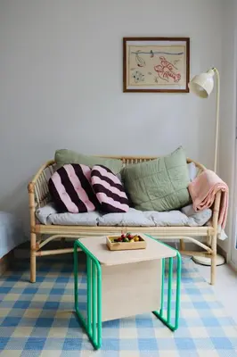 a living room with a couch and a coffee table at Araça Studio - Atlantic Mountain Living in São Vicente