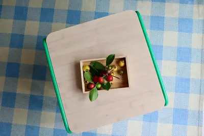 a wooden box with fruit in it on a table at Araça Studio - Atlantic Mountain Living in São Vicente