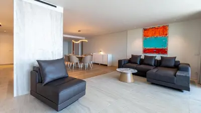a living room with a couch and chairs and a table at Oceanalis by LovelyStay in Funchal