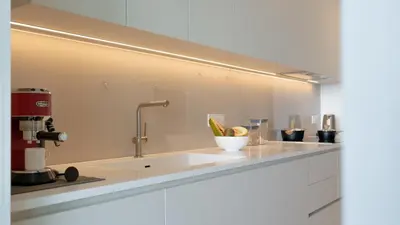 a kitchen counter with a sink with a mixer at Oceanalis by LovelyStay in Funchal