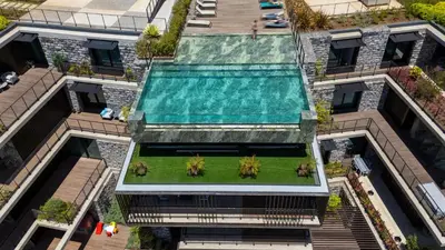 an overhead view of a building with a swimming pool at Oceanalis by LovelyStay in Funchal