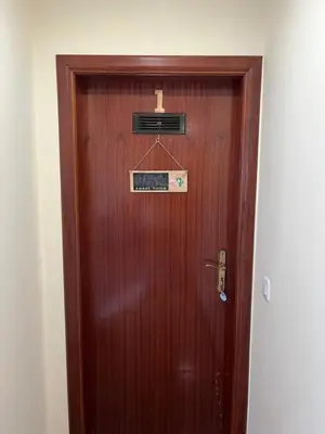 a wooden door with a sign on it at Casa Costa in Santa Maria Madalena