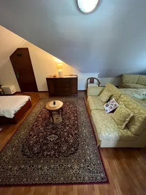 a living room with a couch and a table at Casa Costa in Santa Maria Madalena