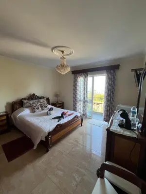 a bedroom with a bed and a large window at Casa Costa in Santa Maria Madalena