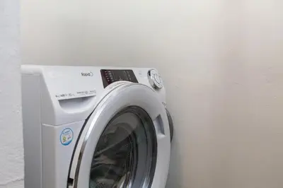 a washing machine sitting next to a wall at A28 - Castela Street Townhouse in Espiche in Luz