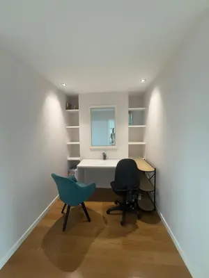 a office with a desk and a chair in a room at Sunny modern 2 bedroom apartment in Funchal