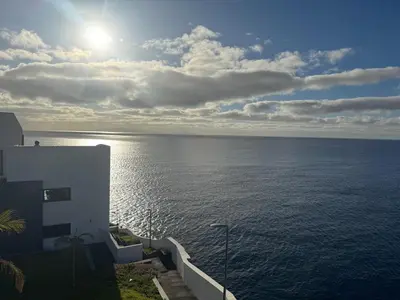 a view of the ocean from the balcony of a house at Almar Ocean Retreat in Gaula