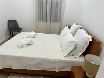 a bedroom with a bed with towels on it at Refúgio Ponta do Sol - Madeira Inn Group in Ponta do Sol