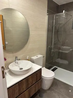 a bathroom with a sink and a toilet and a shower at Refúgio Ponta do Sol - Madeira Inn Group in Ponta do Sol