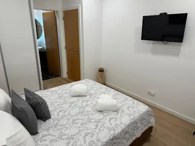 a bedroom with a bed with two pillows on it at Refúgio Ponta do Sol - Madeira Inn Group in Ponta do Sol
