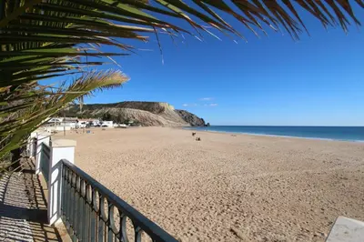 a view of a beach with people on it at The Oceanfront Studio Luz VR110 in Luz