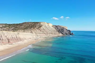 an aerial view of a beach with a mountain at The Oceanfront Studio Luz VR110 in Luz