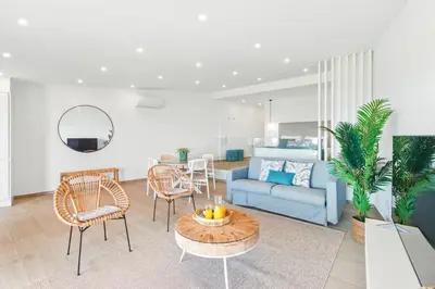 a living room with a couch and a table at The Oceanfront Studio Luz VR110 in Luz