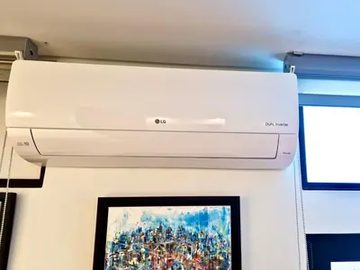 a printer on a wall with a painting of a painting at Modern Studio with Kitchen & Secure Parking in Funchal in Funchal