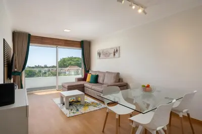 a living room with a glass table and a couch at Madeira Ocean View by An Island Apart in Santa Cruz