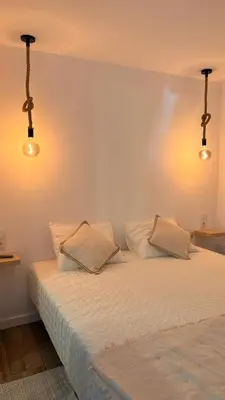 a bedroom with two beds and two lights at Old Aqueduct Village 2 - Guesthouse Madeira in Serra de Água