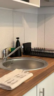 a kitchen sink with a faucet on a counter at Old Aqueduct Village 2 - Guesthouse Madeira in Serra de Água