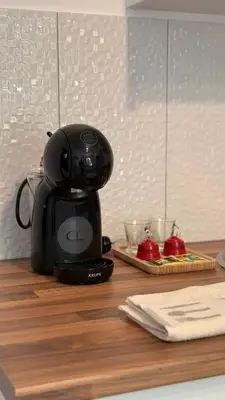 a black coffee maker sitting on top of a counter at Old Aqueduct Village 2 - Guesthouse Madeira in Serra de Água