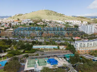 an aerial view of a city with buildings and tennis courts at Savoy Monumentalis Ocean View By LM & AC Signature in Funchal