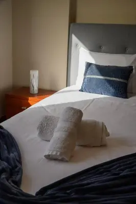 a white bed with two pillows on top of it at Gorete Apartment 2 by Mth in Funchal