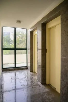 an empty hallway with two doors and a large window at Gorete Apartment 2 by Mth in Funchal