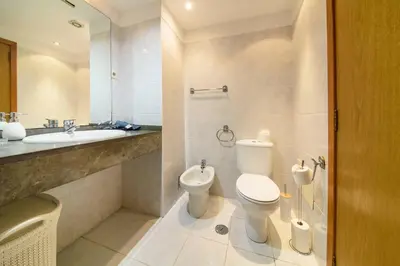 a bathroom with a toilet and a sink at Gorete Apartment 2 by Mth in Funchal