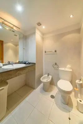 a bathroom with a toilet and a sink and a tub at Gorete Apartment 2 by Mth in Funchal