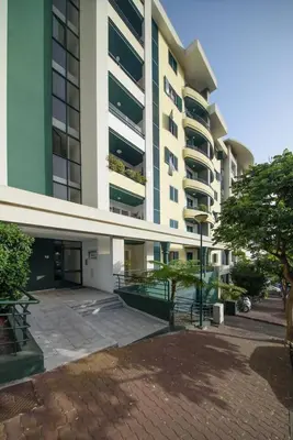 a large apartment building with a patio in front of it at Gorete Apartment 2 by Mth in Funchal