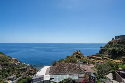 a view of the ocean from a mountain at Calheta Hills III by An Island Apart in Calheta