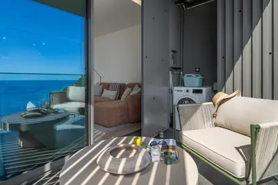a living room with a view of the ocean at Calheta Hills III by An Island Apart in Calheta