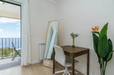 a white bathroom with a tub and a sink at Villa Pargo Green by Madeira Dream Stays in Ponta do Pargo