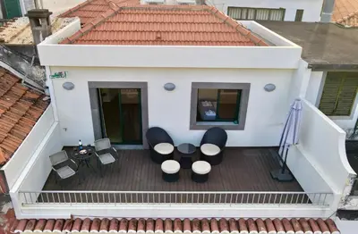 an overhead view of a balcony with chairs and tables at Sea and Sun 4 You - BeatMann in Funchal