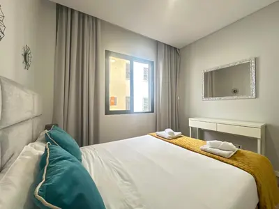 a bedroom with a bed with two towels on it at Sea and Sun 4 You - BeatMann in Funchal