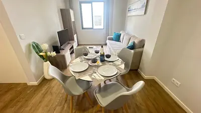 a small living room with a table and chairs at Sea and Sun 4 You - BeatMann in Funchal