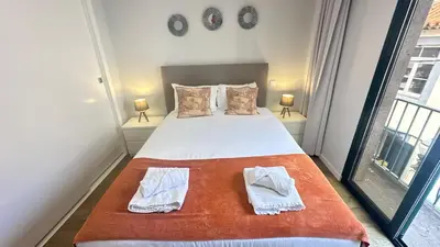 a bedroom with a bed with two towels on it at Sea and Sun 4 You - BeatMann in Funchal