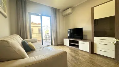 a living room with a couch and a television at Sea and Sun 4 You - BeatMann in Funchal