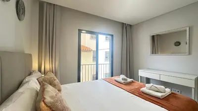 a bedroom with a bed with two towels on it at Sea and Sun 4 You - BeatMann in Funchal