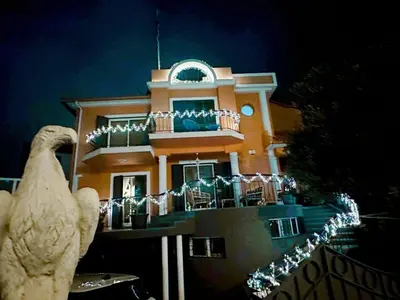 a building with a bird statue in front of it at VILLA Valhalla Private heated swimming-pool in Funchal