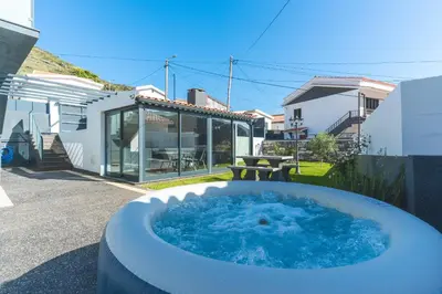 a hot tub in the backyard of a house at Villa Magnolia by Atlantic Holiday in Machico