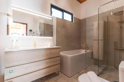 a bathroom with a tub and a sink and a shower at Villa Magnolia by Atlantic Holiday in Machico