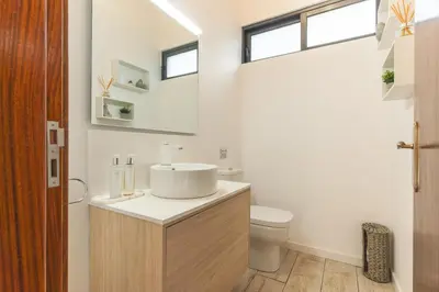 a bathroom with a sink and a toilet at Villa Magnolia by Atlantic Holiday in Machico