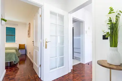 a hallway with a door leading to a bedroom at Carmo Lookout in Câmara de Lobos
