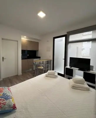 a bedroom with a large bed with two pillows on it at Valhalla Madeira Apartements in Funchal