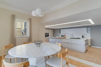 a kitchen with white cabinets and a ceiling at Luxury Villa Pembe Palheiro Village by Holiday Rental Madeira in Funchal