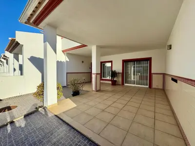 an empty house with a courtyard with a door at Burgau Serenity in Luz