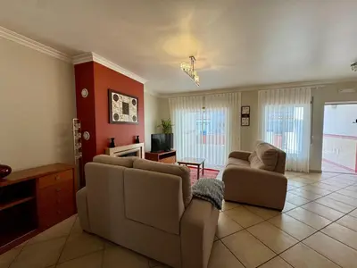 a living room with two couches and a television at Burgau Serenity in Luz