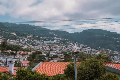 a view of a city with houses and mountains at Casa d'Avo - 3BD cosy home in Funchal