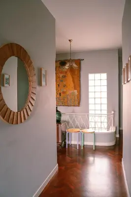 a living room with a mirror and a table at Casa d'Avo - 3BD cosy home in Funchal